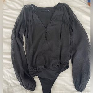 Black long sleeved bodysuit